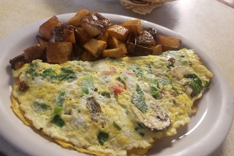 omlette with potato wedges on the side